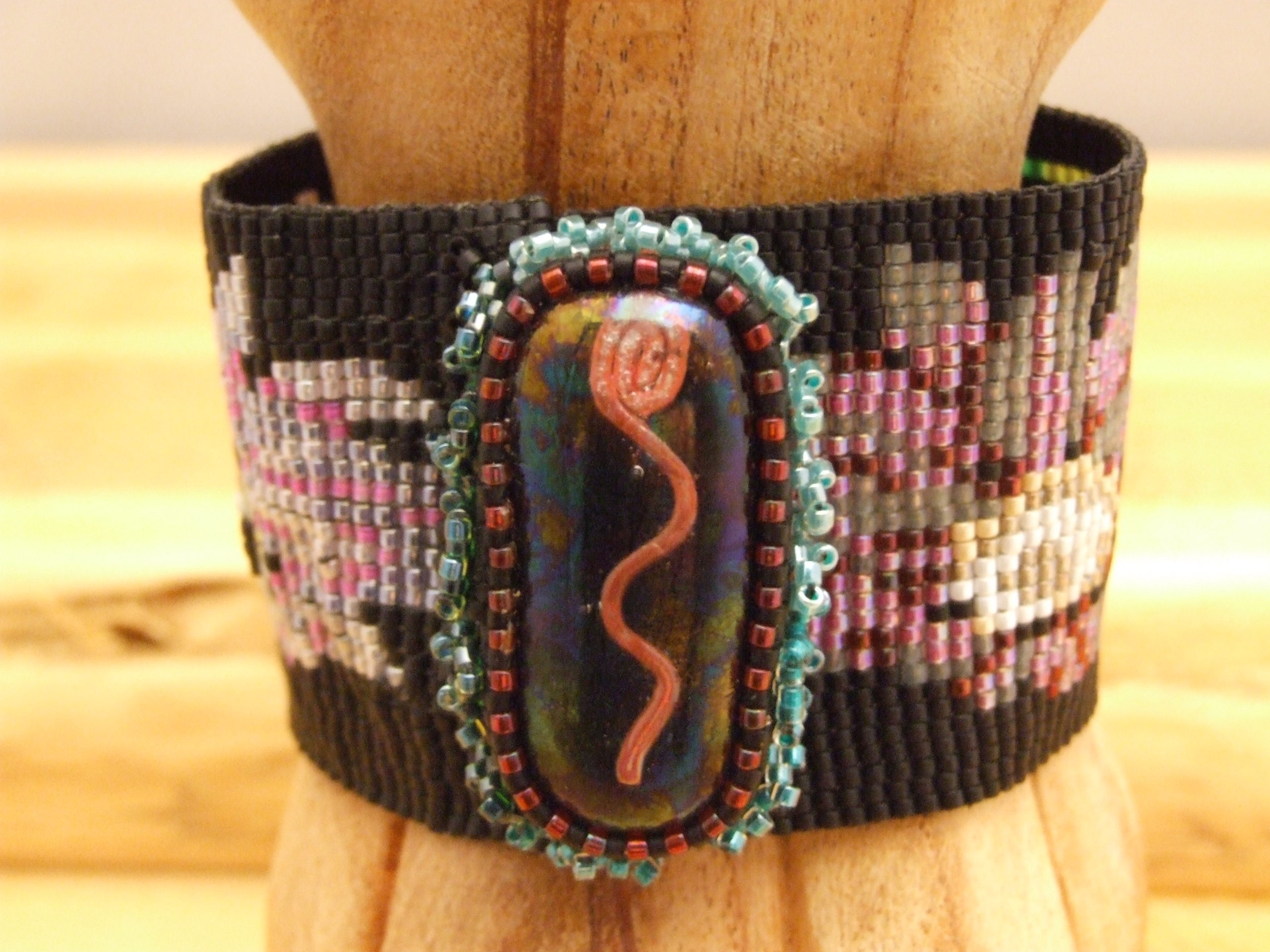 Loom woven beaded bracelet, with fused glass clasp by Lynn Smythe.