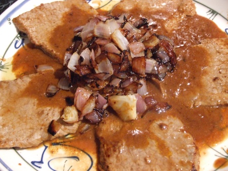 Steak smothered with onions