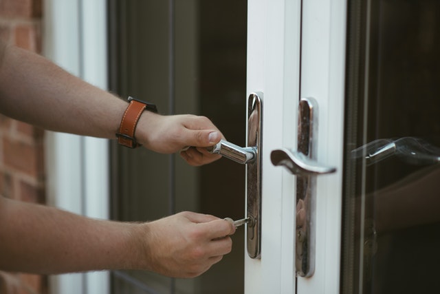 Man opening bifold doors