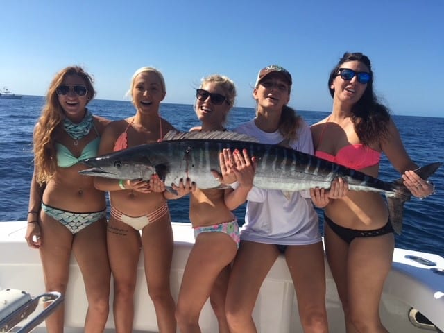 women enjoying deep sea fishing trip with Shake N Bait Charters