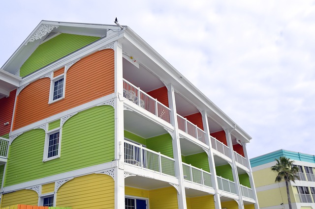 exterior of colorful Key West style apartment complex