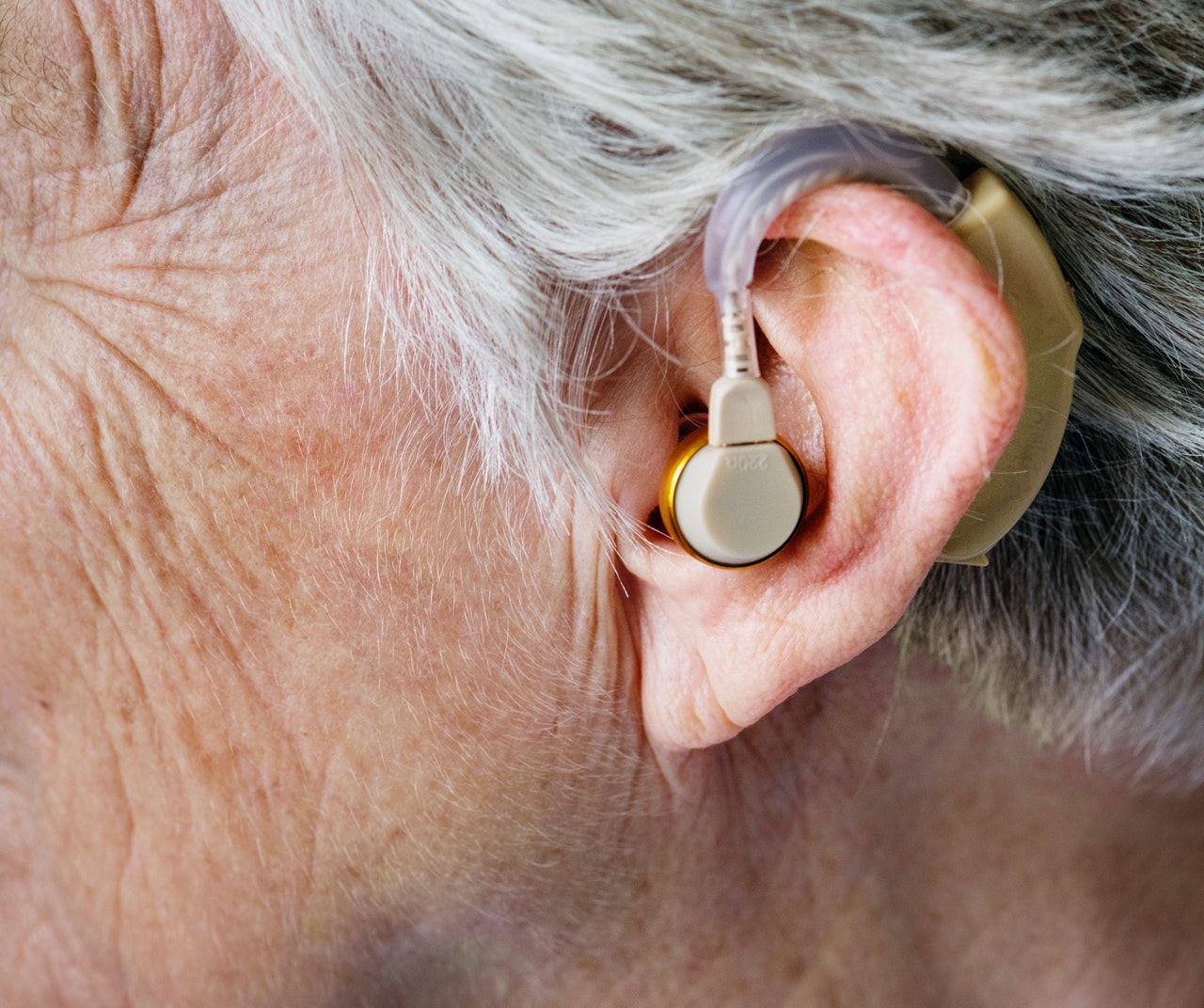 senior woman wearing hearing aid