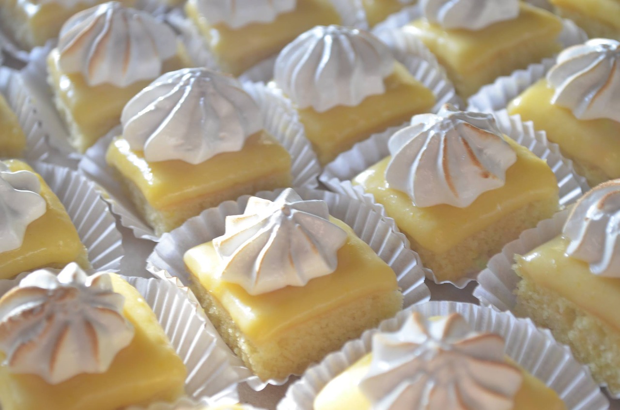 lemon bar desserts topped with whipped cream